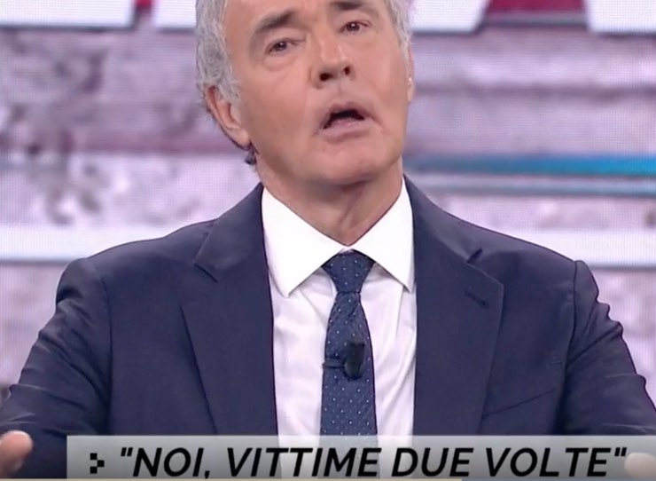 Massimo Giletti che cerca di calmare la lite in diretta